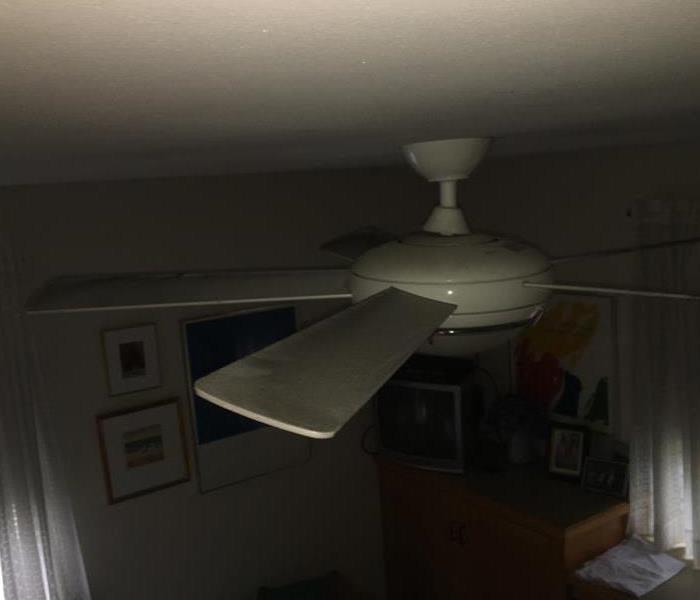 smoke and soot damage on a ceiling fan